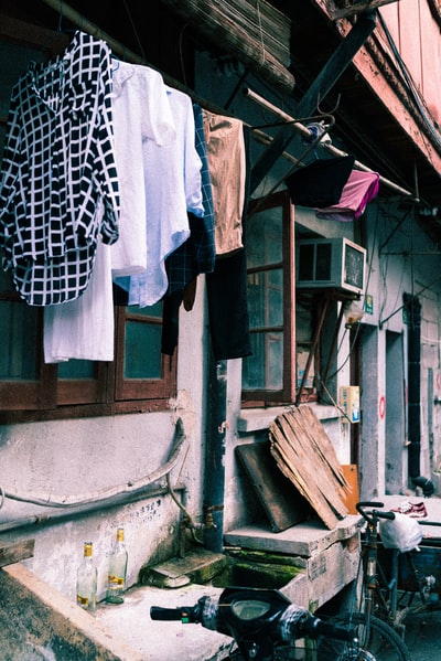 All kinds of clothes hung in the window washing line
